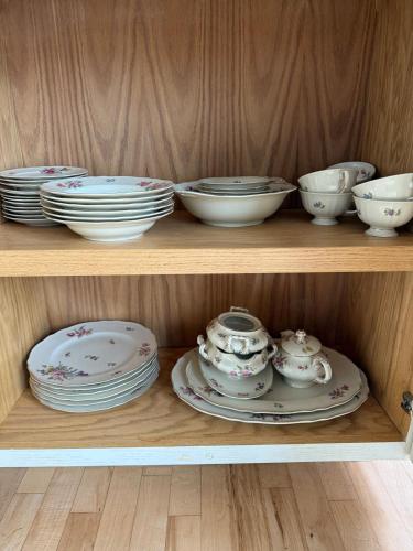 a wooden shelf with plates and bowls on it at Ground-level bed bath house1mi to the beach sleep8 in Long Branch