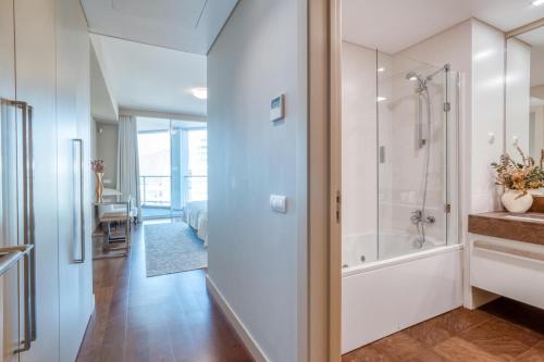 a bathroom with a shower and a bath tub at Suite 107 in Funchal