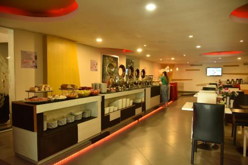Restoran atau tempat lain untuk makan di Hotel American Golf
