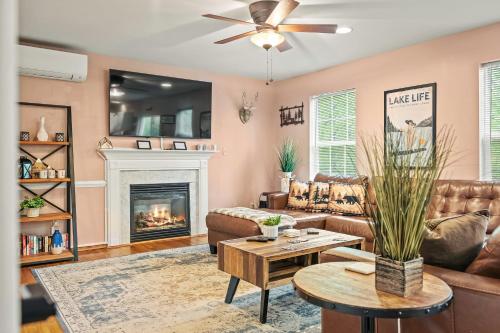 a living room with a couch and a fireplace at Lakeview Retreat w Kayaks Game Room Firepits Gated Community w Lake Beach Access in East Stroudsburg