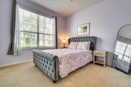 a bedroom with a bed and a window at Southern Dunes Family Retreat Hot Tub and Game Room in Haines City