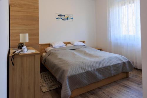 Postel nebo postele na pokoji v ubytování Lesi Vendégház