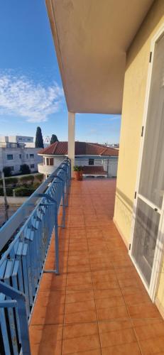 a balcony with a blue bench on a building at Cristal Appartament in Brindisi