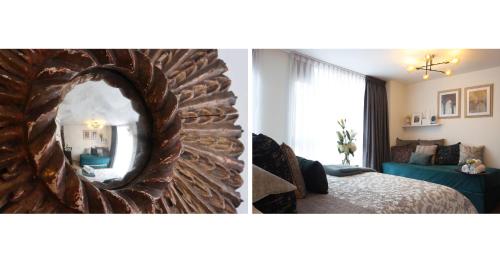 a room with a mirror and a bedroom with a bed at MONTFORT Suite Royale Stylish Location with View to Bogotá's historical Church in Bogotá