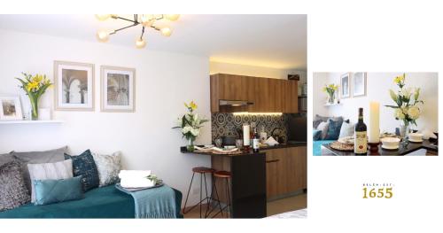 a kitchen and a living room with a couch and a table at MONTFORT Suite Royale Stylish Location with View to Bogotá's historical Church in Bogotá