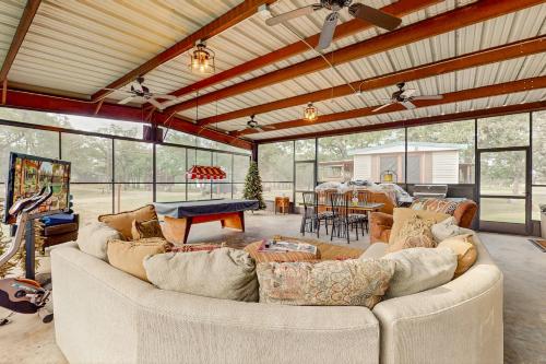 a living room with a large couch and a table at 4 Cabins - Reindeer Ranch at Round Top in Carmine