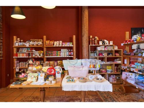 a store with a table and shelves of products at Fiore Shima - Vacation STAY 25659v in Shima