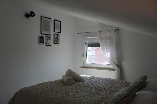 Ένα ή περισσότερα κρεβάτια σε δωμάτιο στο Apartman Buba