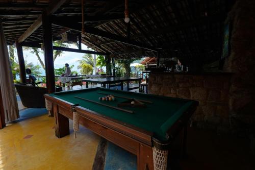 a pool table sitting inside of a bar with at Casa da Ilha & SPA in Abraão