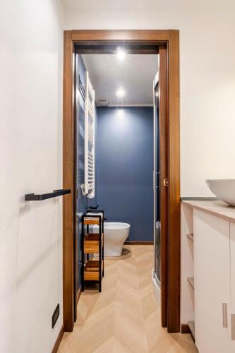 a bathroom with a toilet and a sink at Italian Essence - Bergamo Center in Bergamo