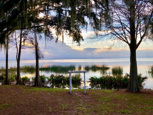 a sign in front of a body of water at Holiday Inn Orlando International Airport by IHG in Orlando
