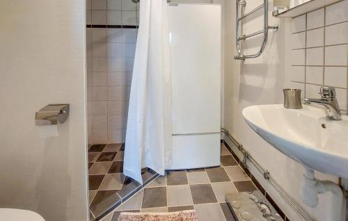 a bathroom with a shower and a toilet and a sink at 1 Bedroom Beautiful Home In Gantofta in Gantofta