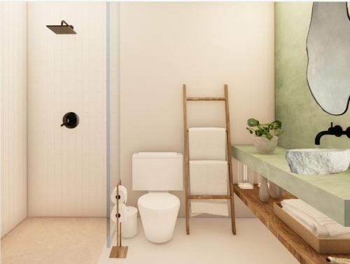 a bathroom with a toilet and a shelf and a mirror at Aytana Luxury Living in Chuburná