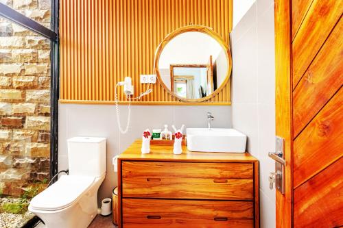 a bathroom with a sink and a mirror at Villa Mewah di Nusa Penida in Nusa Penida
