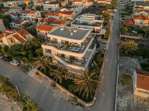 an overhead view of a large house in a city at Apartments Dernaj in Vir