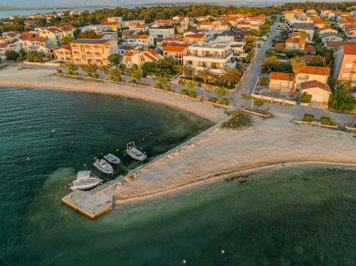 an aerial view of a beach with boats in the water at Apartments Dernaj in Vir