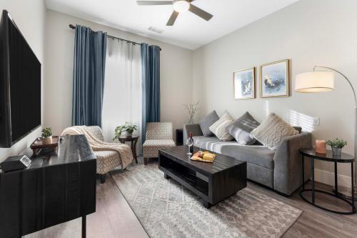 a living room with a couch and a tv at 1 Mi to Dtwn Cozy Retreat in Golden, CO! in Golden