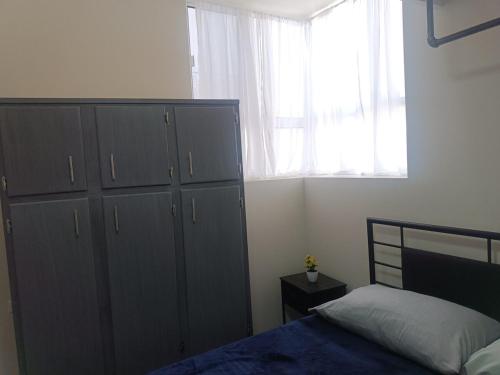 Ένα ή περισσότερα κρεβάτια σε δωμάτιο στο Apartment in Paseos de Chihuahua