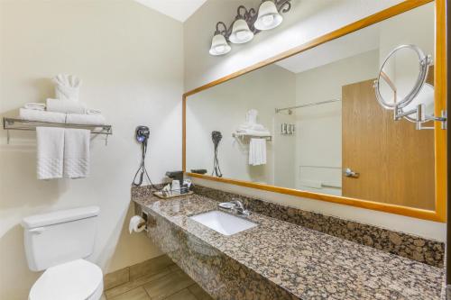 a bathroom with a sink and a mirror at Best Western Gold Canyon Inn & Suites in Gold Canyon