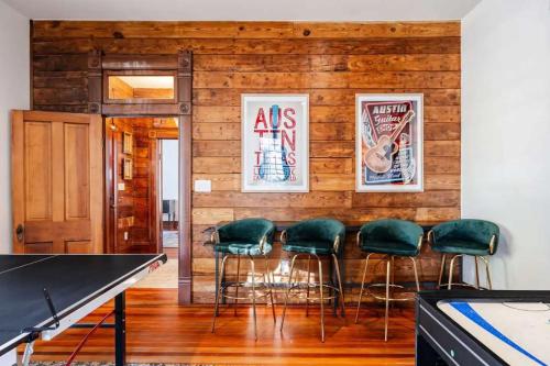 a room with a ping pong table and chairs at Charming 5 Bedroom Home in Austin in Austin