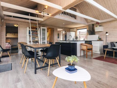 a kitchen and dining room with a table and chairs at 6 person holiday home in Karrebæksminde-By Traum in Karrebæksminde