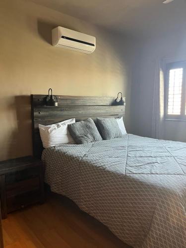 a bedroom with a bed with pillows and a ceiling at Casa Cupulas in Puerto Peñasco