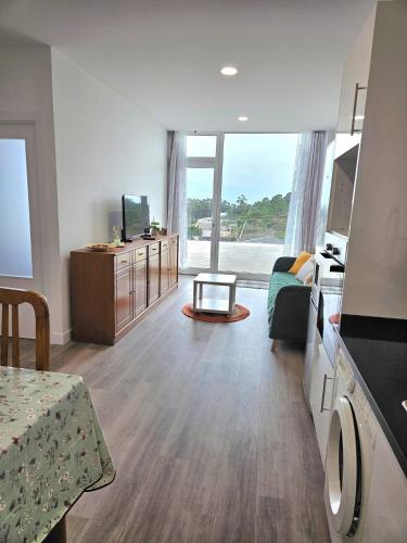 a room with a living room with a room with at Ericeira Ribamar Sea View Villa in Santo Isidoro