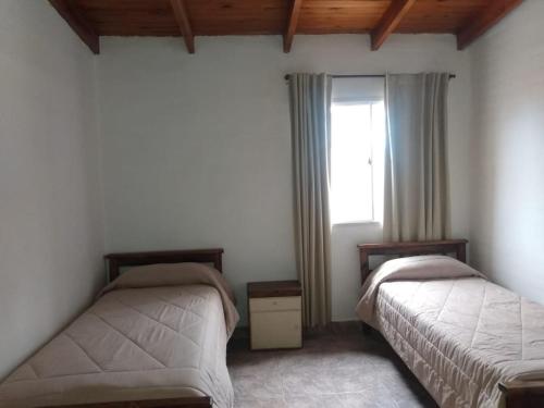 Ένα ή περισσότερα κρεβάτια σε δωμάτιο στο Casa Victoria