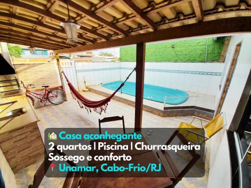 Bazén v ubytování Casa aconchegante Piscina Churrasqueira Cabo-Frio RJ nebo v jeho okolí