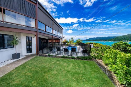 an image of a house with a yard at Day Dreaming - Mazlin House in Airlie Beach