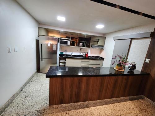 a kitchen with a counter top in a room at High-Standard Home for COP30 in Belém-PA in Ananindeua