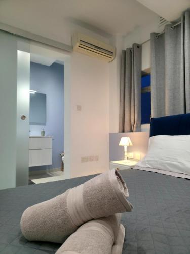 a towel laying on the floor of a bedroom at Marina View in Taʼ Xbiex