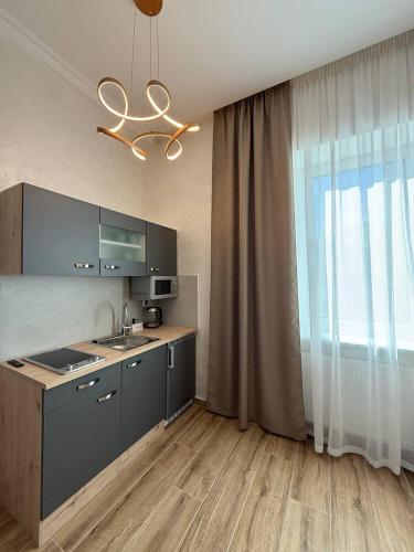 a kitchen with a sink and a counter top at Family Apartments Zemlinski in Payerbach