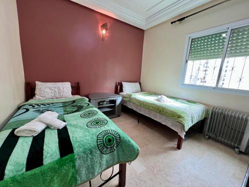 Ένα ή περισσότερα κρεβάτια σε δωμάτιο στο Luxury appartement centre ville fes