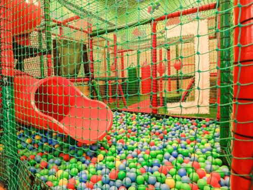 a batting cage filled with lots of balls at Type 10- Ho Holiday Centre holiday home in Blåvand
