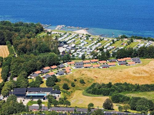an aerial view of a parking lot next to the ocean at 5 person holiday home in Aabenraa in Aabenraa