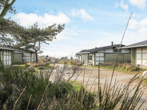 a row of houses on a dirt road at Premium room on a holiday park in Gilleleje in Gilleleje