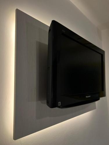 Hotel Los Liriosにあるテレビまたはエンターテインメントセンター