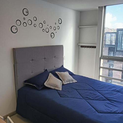 Ένα ή περισσότερα κρεβάτια σε δωμάτιο στο Torre Ventto Loft 24-7