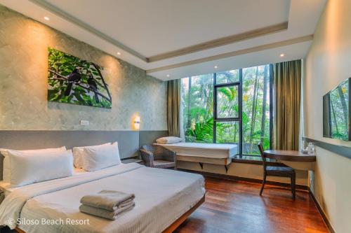Postel nebo postele na pokoji v ubytování Siloso Beach Resort - Sentosa