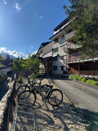 two bikes parked on the side of a street at Monolocale Pescasseroli Residence Palace in Pescasseroli
