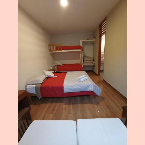 a bedroom with two beds in a room at Villa Lunahuana in Lunahuaná