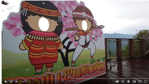 a mural of two people on a tree at Green Field Mountain Villa in Hualing