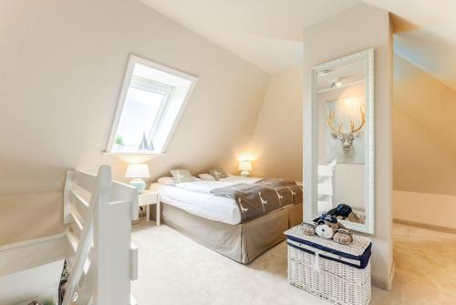 Postel nebo postele na pokoji v ubytování Tunghoern-Hues-1-OG-Wohnung-08