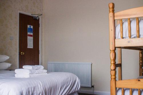 Ένα ή περισσότερα κρεβάτια σε δωμάτιο στο Wellesley Park Hotel