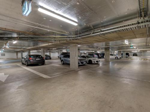 a parking garage with several cars parked in it at ibis Styles Melbourne Airport in Melbourne