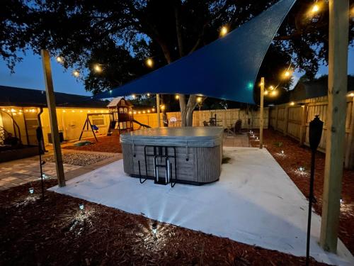 a large tub in a park at night at Hot tub Playground Ping-pong Near beaches! in Largo
