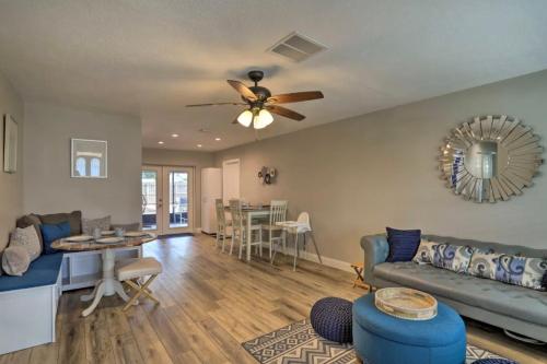 a living room with a couch and a ceiling fan at Hot tub Playground Ping-pong Near beaches! in Largo