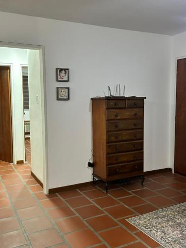 a room with a dresser and a white wall at Comfort and a perfect location in Valencia