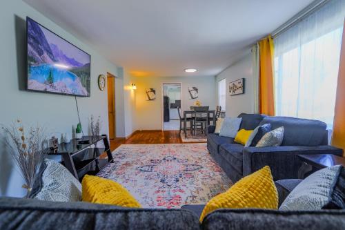 a living room with two couches and a dining room at Charming 2 Bed Room in Cleveland in Cleveland Heights